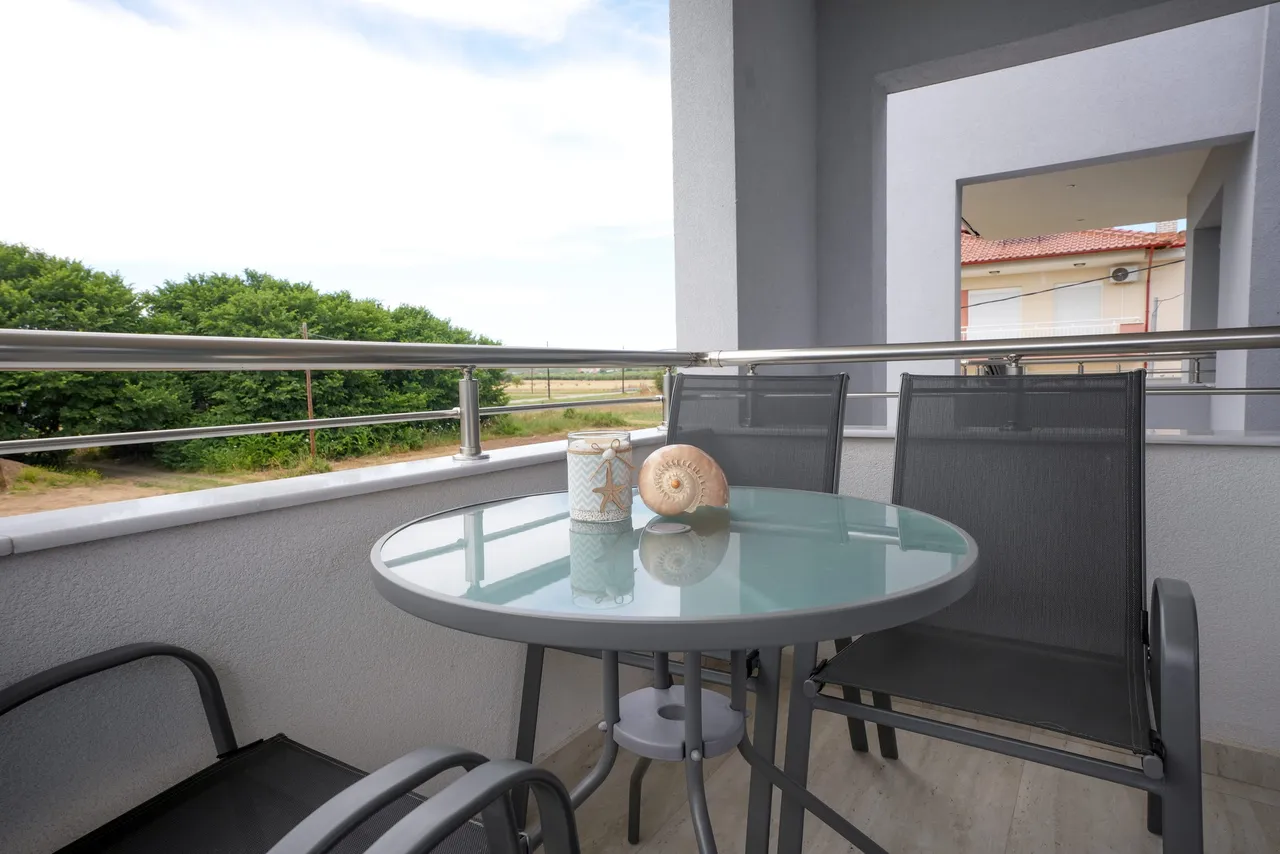 Private furnished balcony with an open landscape view