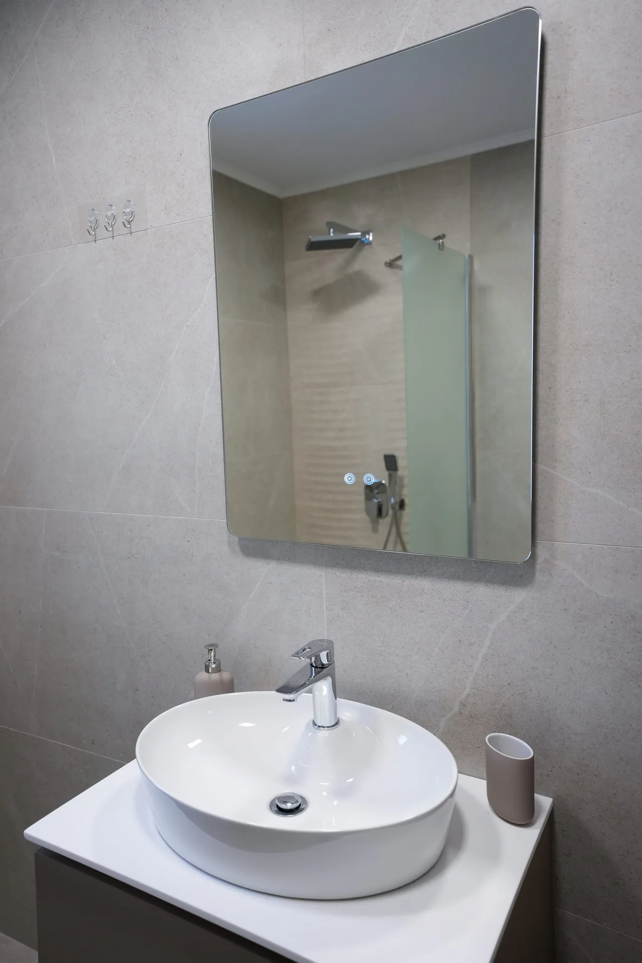 Round basin and mirror in bathroom two