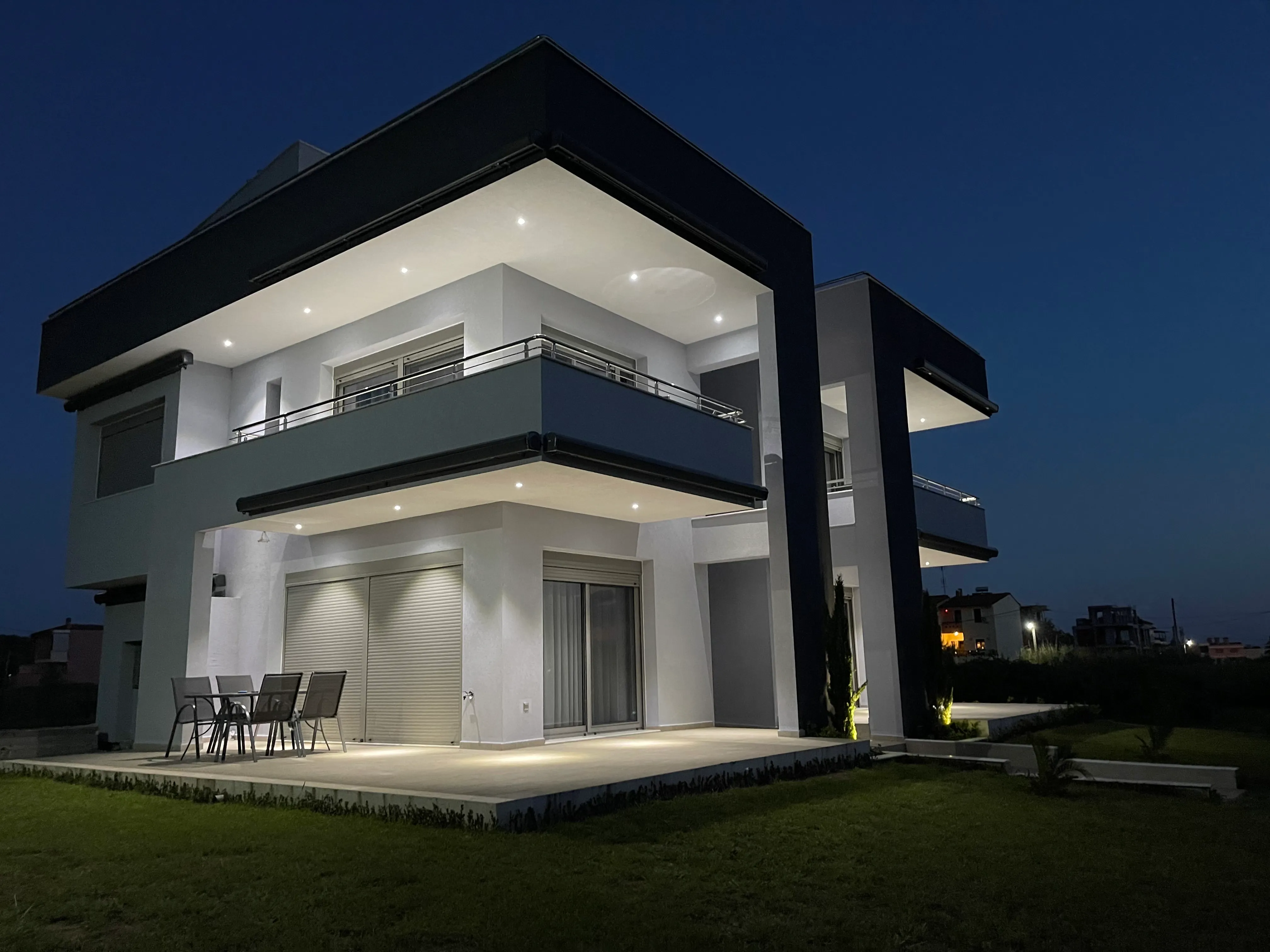 Pearl Luxury Suites illuminated at dusk
