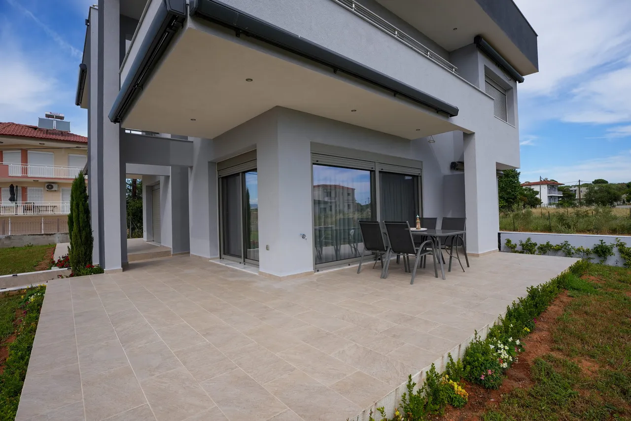 Private ground-floor patio and contemporary facade