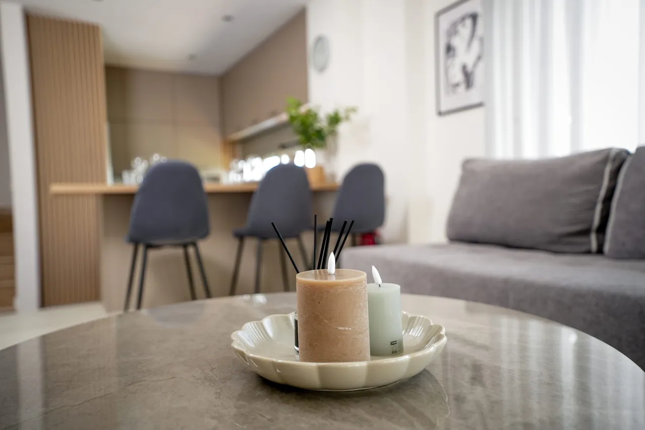 Considered salon detail with dining area beyond